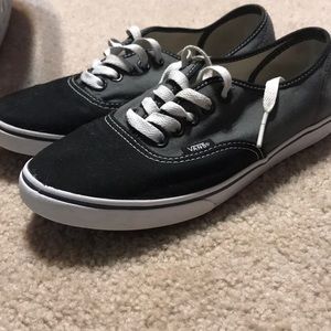 Grey, black, and white Vans.
